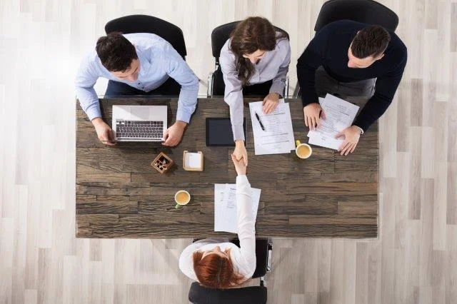 Family nurse practitioner at job interview - shot from above