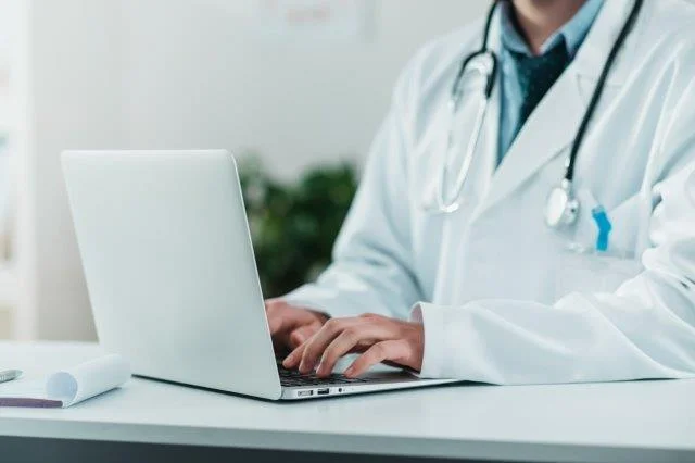 Nurse working on laptop