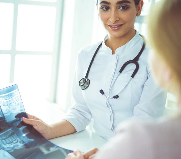 Family nurse practitioner explaining an X-ray to a patient