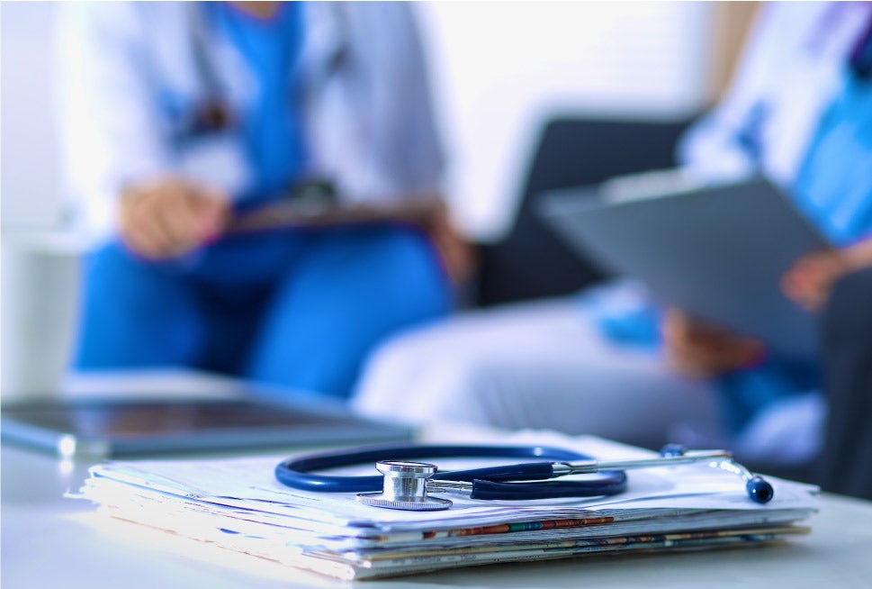 Medical notes and stethoscope in a nurse practitioner's office