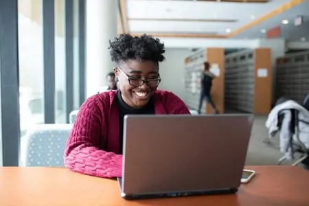 TWU Nurse Practitioner Student Studying on Laptop