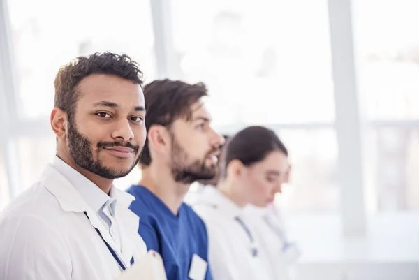 A group of healthcare professionals sitting together while attending a lecture