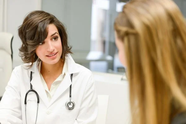 Family nurse practitioner explaining diagnosis to her patient